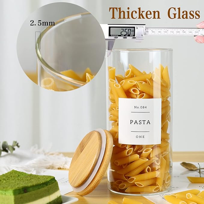 Glass jar with pasta labeled 'Pasta One' on a kitchen counter with measuring tools.