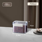 Clear container with food on a gray surface, showing dimensions and capacity details.