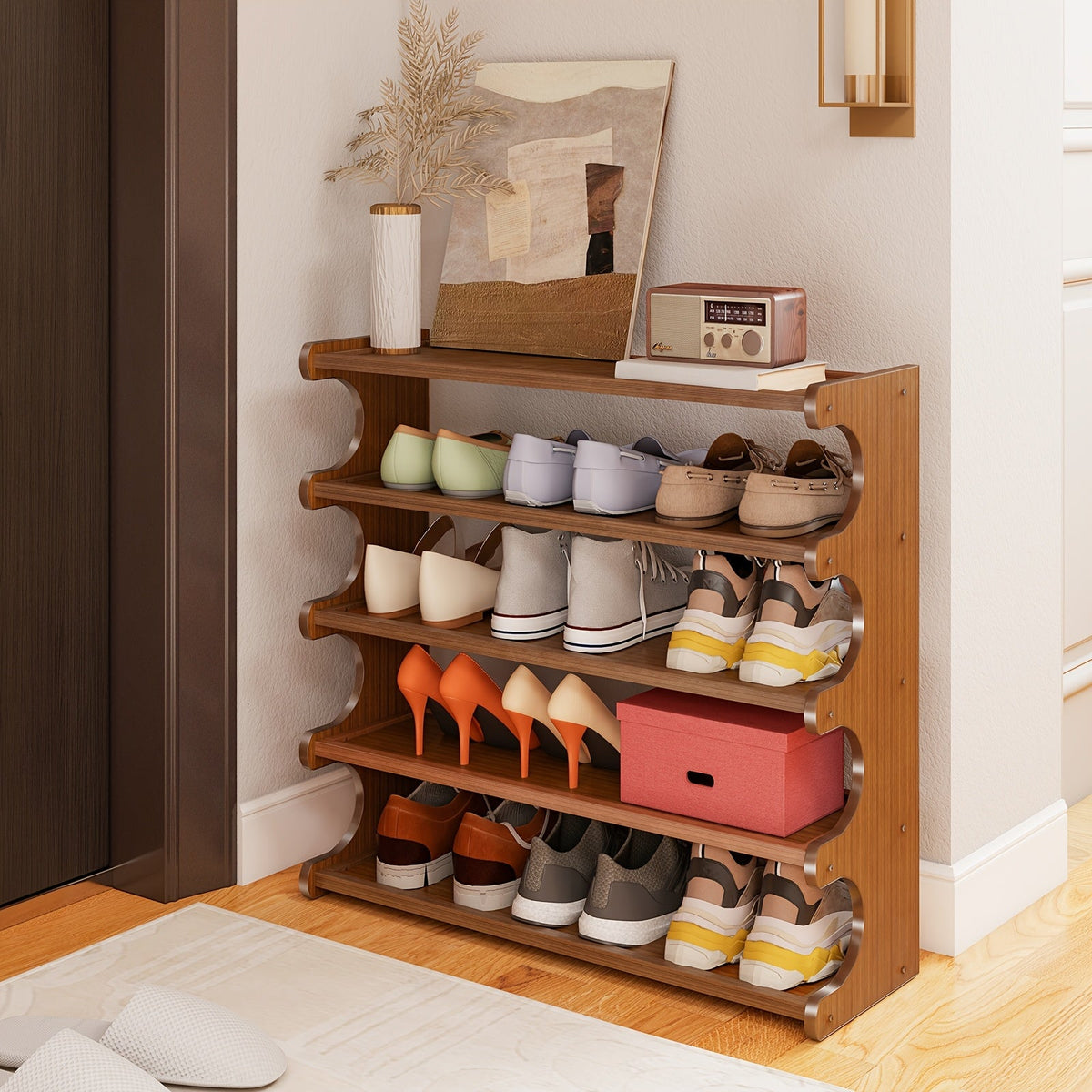 Wooden shoe rack with various shoes on a wooden floor.