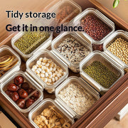 Containerized storage of various food items with text 'Tidy storage Get it in one glance.'