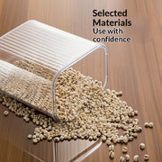 Clear container with materials spilling onto a wooden surface, text 'Selected Materials Use with confidence' above.
