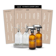 Set of bottles with labels and a box of home and laundry labels on a white background