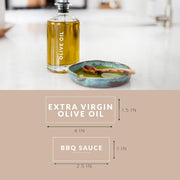 Olive oil bottle and bowl of BBQ sauce on a kitchen counter with measurements.