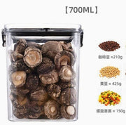 Clear container with dried mushrooms, showing capacity of 700ml, with comparisons to coffee beans, soybeans, and pasta.